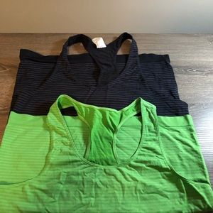 Two Under Armour tank tops, spandex